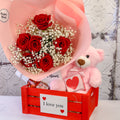 Red rose bouquet and pink teddy with a heart box in a medium red I love you crate