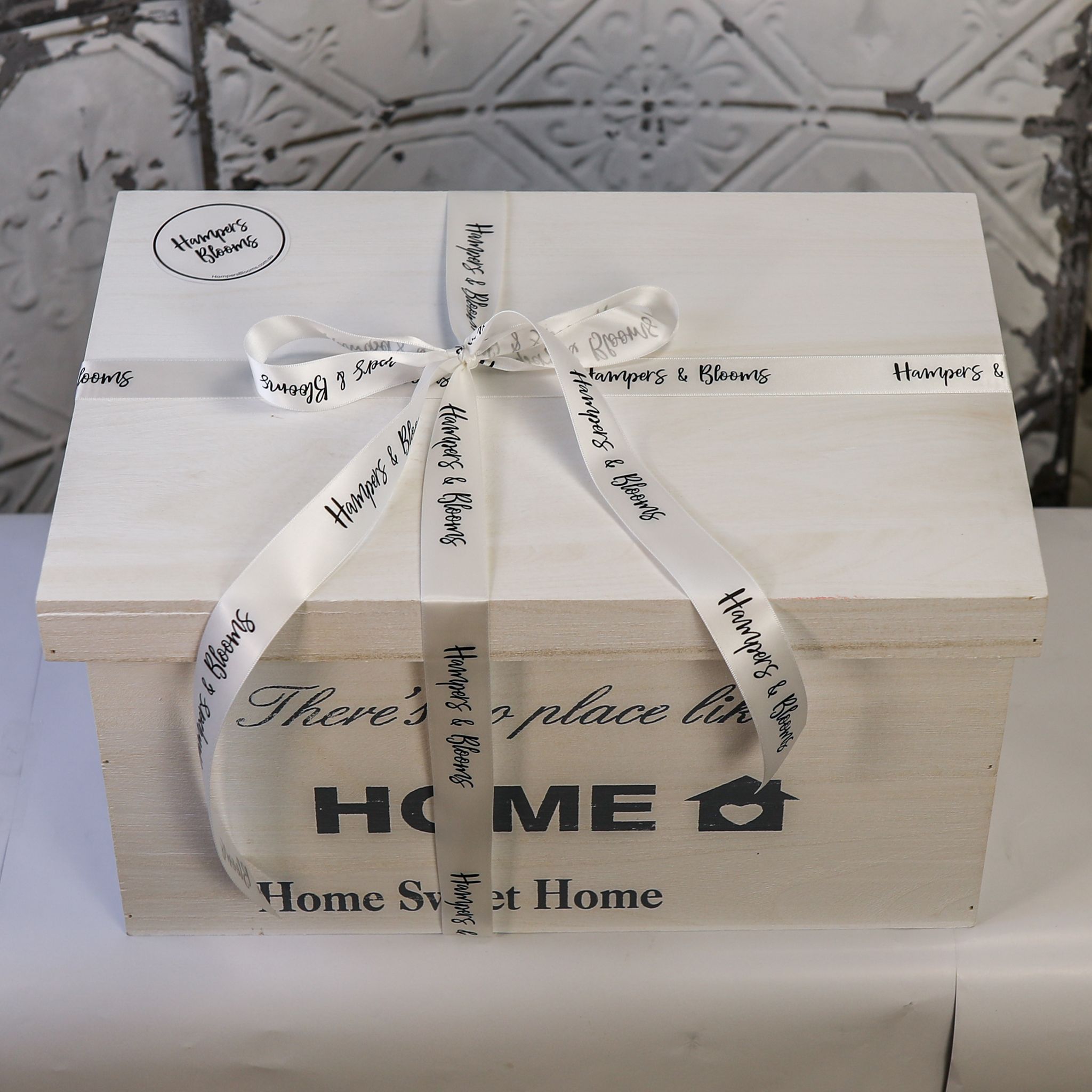 Welcome Baby keepsake chest closed and tied with Hampers & Blooms ribbon